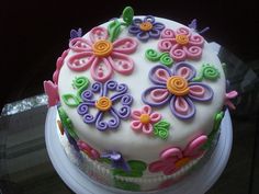 a decorated cake sitting on top of a table