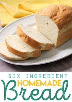 a white plate topped with sliced bread on top of a table