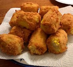 some fried food sitting on top of a white napkin