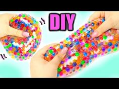 two hands holding colorful beads with the words diy