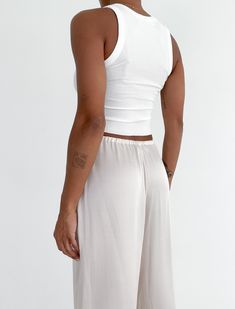 Your new favorite tank with endless styling options. Soft and versatile, with a body contouring fit. Fitted Cami Tank Top For Athleisure, Fitted Tank Top For Loungewear, Fitted Modal Camisole Tank Top, Versatile Fitted Cami Tank Top, Chic High Stretch Seamless Tank Top, Fitted Cami Tank Top, Chic Seamless High Stretch Tank Top, Versatile Tank Top, Chic High Stretch Tank Top For Layering