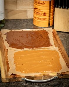 some peanut butter on a wooden cutting board