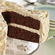 a close up of a slice of cake with frosting on the top and bottom