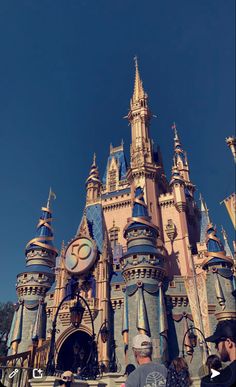 people are standing in front of the castle