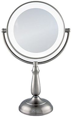 a small round mirror on top of a metal stand