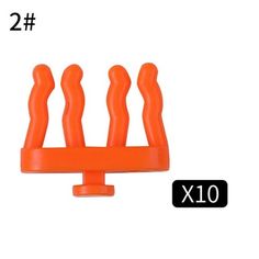 an orange plastic object with four legs on it