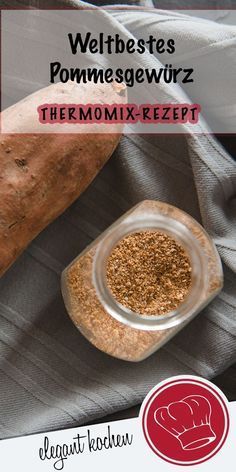 there is a small bowl with some spices in it next to a large piece of bread