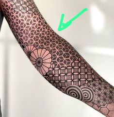 the arm is decorated with intricate designs and an arrow pointing to it's left side