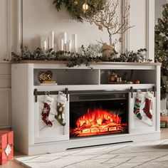 a christmas fireplace with stockings on it