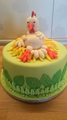 there is a cake decorated with a chicken on it