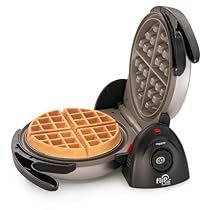 the waffle maker is sitting next to it's tray