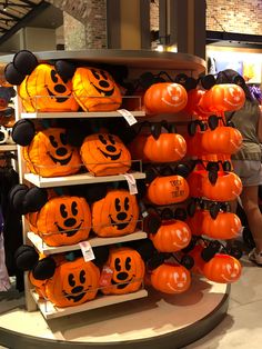 there are many pumpkins on display in the store