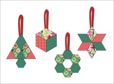 three origami christmas ornaments hanging from red ribbon on top of each other with green and pink designs