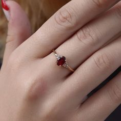 You deserve to own this beautiful Celtic Ruby gemstone ring. Made by hand to your size and choice of finish. ✦ Gemstone Type - Lab grown Ruby, White Zircon ✦ Gemstone Cut - Oval facet ✦ Gemstone Size - 7x5 (oval) 1.5mm (round) ✦ Total Number of Gemstones - 3 ✦ Finish - 14k Gold Filled (Tarnish Resistant And Nickel Free) - also available in 925 sterling silver * For rings over size 11 please contact us for special pricing. * Custom made designs questions are welcome! ♢ Important information ✦ We Gold Rings With Ruby Stone, Gold Rings With Red Stone, Ruby Wedding Rings Vintage, Woman Ring Design, Red Rings Engagement, Stone Ring Design Gold For Women, Hand Rings Gold, Ruby Rings Women, Rubi Ring