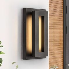 a modern outdoor wall light mounted on the side of a building with wooden slats