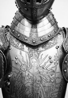 an elaborately detailed metal armor is shown in black and white