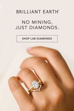 a woman's hand holding a diamond ring with the words brilliant earth no mine just diamonds