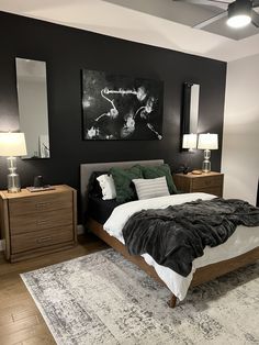 a bedroom with black walls and white carpet