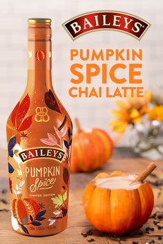 a bottle of baileys pumpkin spice chai latte next to some pumpkins