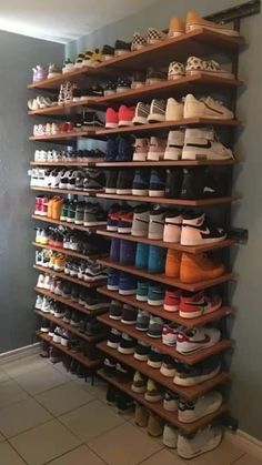 a large shoe rack with many pairs of shoes on it