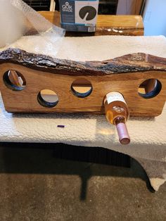 a wine bottle holder made out of wood