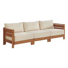 a wooden couch with white pillows on it's back and side cushions, in front of a white background