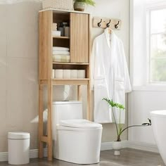 This over the toilet storage cabinet features a unique corrugated recessed panel with blister molding technology that adds texture and a sense of space, creating an extraordinary piece for your space. With white faux marble countertop with melamine veneer, delicate texture. With smooth curved edges and wide metal handles, it has both classic and modern charm.Maximize the size of your organization with our multifunctional cabinets. With adjustable shelves, sliding doors and a semi-open bottom com Over The Toilet Storage Cabinet, Faux Marble Countertop, Toilet Storage Cabinet, Over Toilet Storage, Over The Toilet Storage, Bathroom Space Saver, Over The Toilet Cabinet, Freestanding Bathroom Cabinet, Over The Toilet