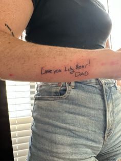 a woman with a tattoo on her arm that says love you'll be dad