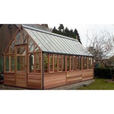 a small wooden house with a metal roof