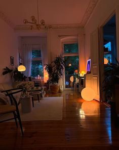 a living room filled with furniture and lots of lights on the windows sills