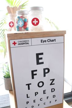 an eye chart is displayed on a wooden stand