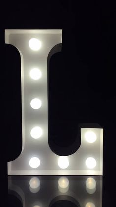 the letter j is lit up with lights