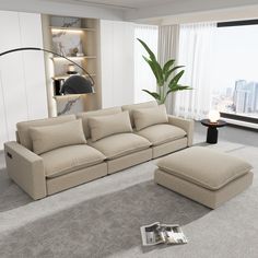 a living room with a couch and ottoman