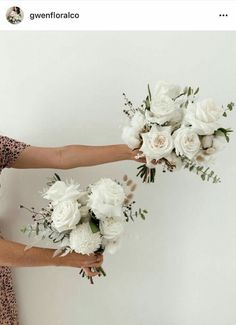 two women holding bouquets of white flowers in their hands, both wearing leopard print dresses