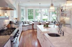 the kitchen is clean and ready to be used for cooking or eating, while also being used as a living room