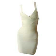 LOVE LALI VINTAGE Herve Leger mint green elasticated bandage dress Body con fit Low cut cross over bust Backless cut with criss cross straps Concealed back zip with three hidden hooks Composition: No composition label Size: XXS with plenty of stretch In excellent condition - please note that the brand label has come loose on one side Measurements: Underarm to underarm 26" unstretched Waist 19" unstretched Length 32" Herve Leger 90s, Herve Leger Dress Bandage, Evil Vampire, Vampire Core, Black Maxi Gown, Barbie Closet, Informal Dress, Velvet Bustier, Herve Leger Dress