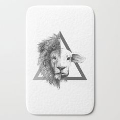 a lion's head with a triangle in the background on a white bath mat