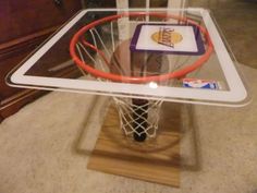 a glass table with a basketball hoop on it