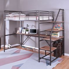 a loft bed with a desk underneath it