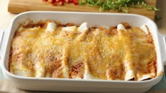 a casserole dish filled with cheese and meat