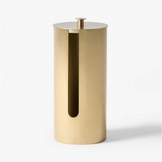 a gold colored metal container with a black handle on the top and bottom, in front of a white background