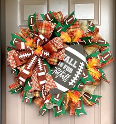 a football wreath is hanging on the front door