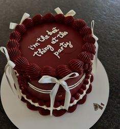 a red and white birthday cake on a plate