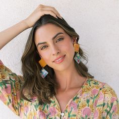 The Burnt Teja Drop Earrings are inspired by spanish floral tiles with rich colors and beautiful illustrations. Prepare yourself, they're going to be the center of attention! Color: White, Red, Green, Yellow, Blue and Terracotta Size: 1 1/2" x 3 1/2" Lightweight Buffalo horn Stainless Steel ear post Your earrings are made from all-natural material and as such the horn color may vary slightly from what is shown. While all horn is very similar in appearance, no two are exactly the same. This guara Blue And Terracotta, Floral Tiles, Green Yellow Blue, Water Buffalo, New Braunfels, Red Green Yellow, Rich Colors, Natural Material, Clothing Company