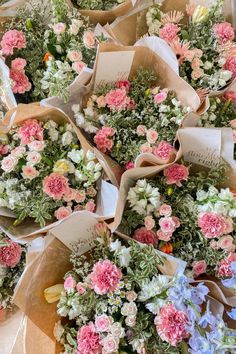 many bouquets of flowers are laid out on the table together and ready to be picked up