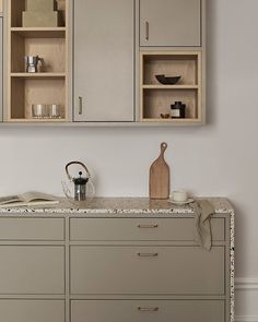 a kitchen with an oven, cabinets and counter top in it's center area