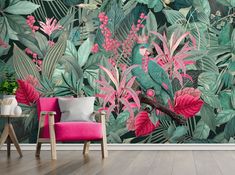 a living room with a large wall mural featuring pink flowers and green leaves