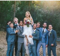 a bride and groom with their wedding party