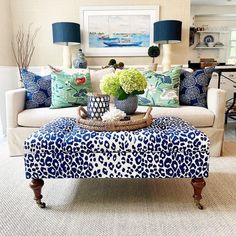 a living room with blue and white decor