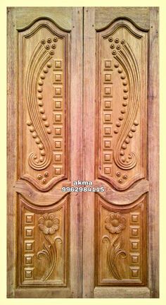 two wooden doors with decorative carvings on them